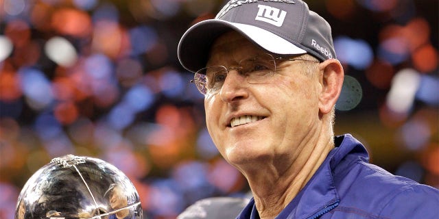 Tom Coughlin holds Vince Lombardi trophy