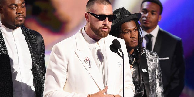 Travis Kelce accepts an award at the ESPYs
