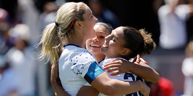 Lindsey Horan, Sophia Smith, and Trinity Rodman celebrate