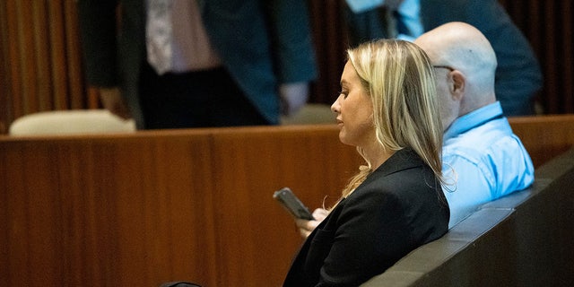 Dr. Katherine Roxanne Grawe sits during medical board hearing after having her license revoked