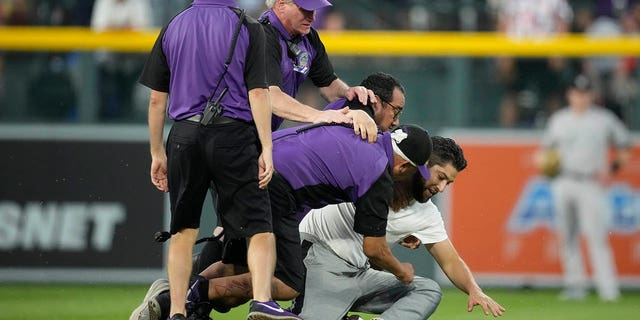 Fan tackled at Coors Field