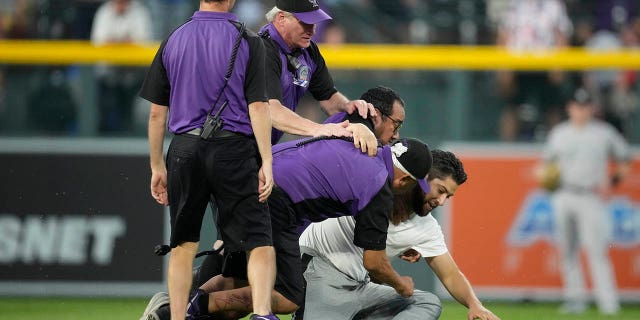 Fan tackled at Coors Field