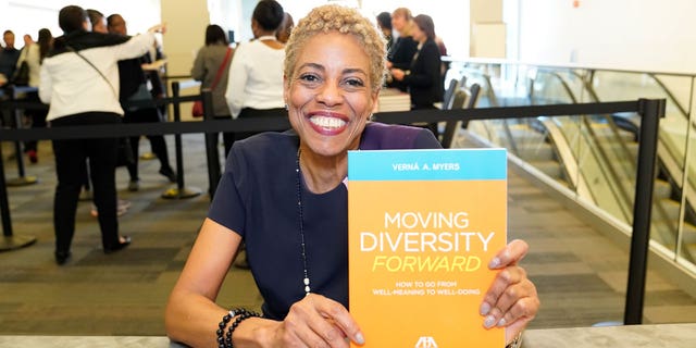 Vernā Myers holds diversity book