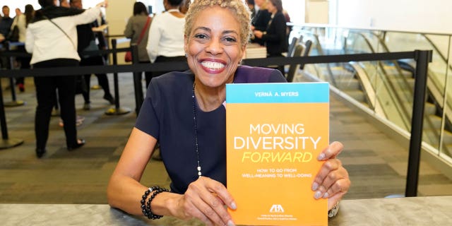 Vernā Myers holds diversity book