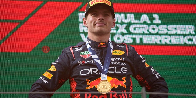 Max Verstappen smiles on podium