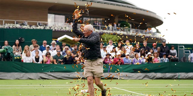 A protester throwing confetti