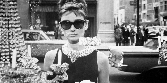 Black and white photo of Audrey Hepburn as Holly Golightly in "Breakfast at Tiffany's"
