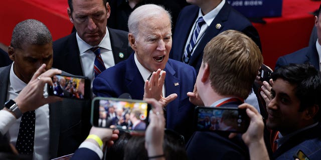 Joe Biden in a pool of reporters