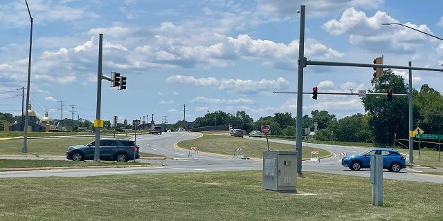 Police cars are pictured responding to the scene where a shooting was reported
