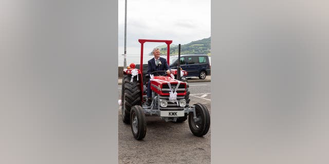 Kathryn McKay's dad drives tractor