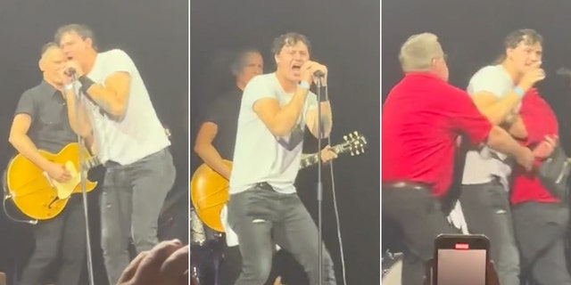 Series of pictures showing a man in dark jeans and light t-shirt interrupting Byran Adams at the microphone during his concert before being taken away by security in red shirts