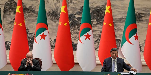 Chinese President Xi Jinping, right, and Algerian President Abdelmadjid Tebboune, left