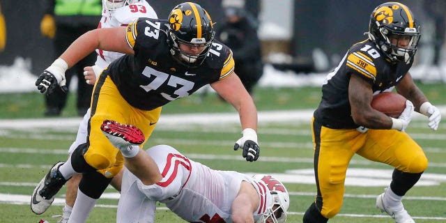 Cody Ince blocks a Wisconsin defender