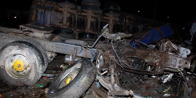 The wreckage of vehicles lies on the ground after a fatal accident in Londiani, Kenya