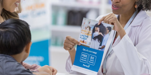 woman showing flu shot options