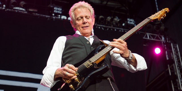 Don Felder on stage while on tour with Foreigner in 2014