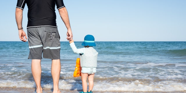 Father and son at beach