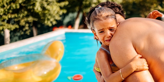 girl crying at pool