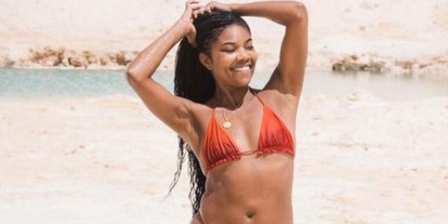 A photo of Gabrielle Union in a red bikini