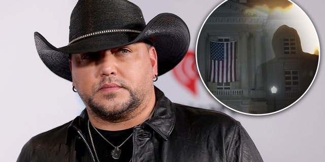 Jason Aldean looks serious in a black cowboy hat. "Try it in a small town." video
