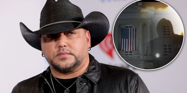 Jason Aldean sieht ernst aus in einem schwarzen Cowboyhut mit eingesetztem Kreis "Versuchen Sie das in einer Kleinstadt" Video
