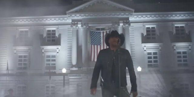 Jason Aldean sings in front of the Maury County courthouse with an American flag in his music video for "Try That In A Small Town"