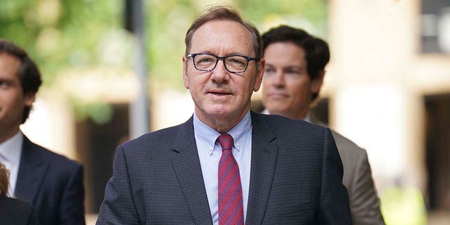 Kevin Spacey walking into court