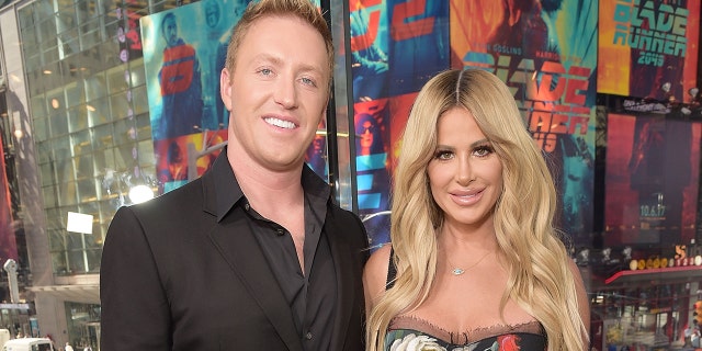 Kim Zolciak and Kroy Biermann smile at Times Square photo opportunity