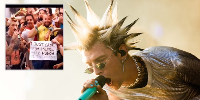 Machine Gun Kelly with long spikes sticking up sings into the microphone looking down, inset a photo of him next to a fan holding a sign asking to be punched