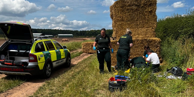 Farmer trapped under hay