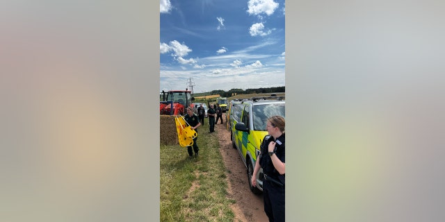 Farmer trapped under hay