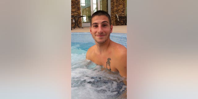 Michael Burham in a hot tub