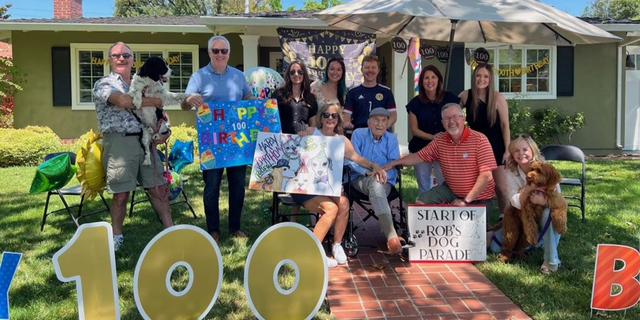 Moore surrounded by family and friends at home