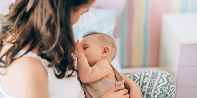 Woman breastfeeding child