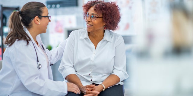 Older woman with doctor