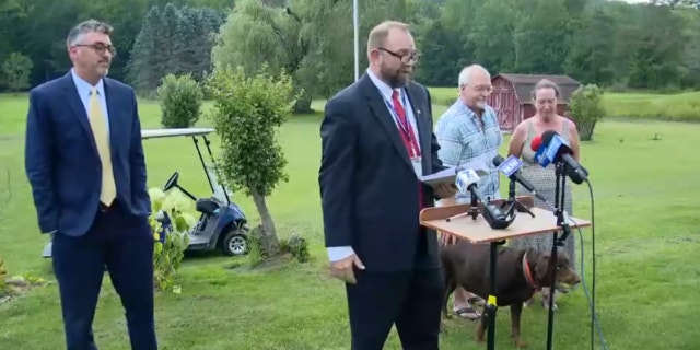 Ecklund couple and AG at presser