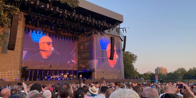 Billy Joel performs piano on stage