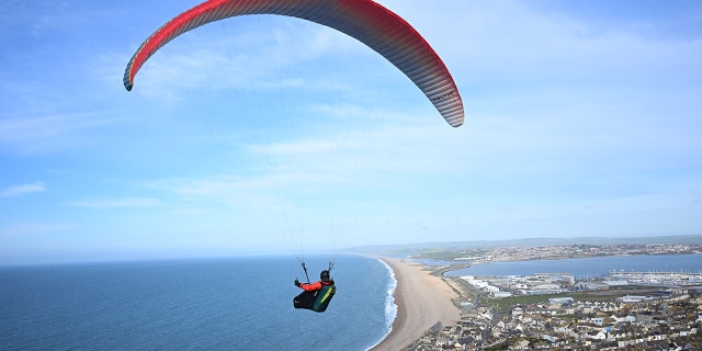 A person paragliding in England