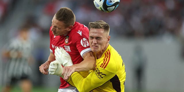 Paul Mullin collides with Nathan Bishop during a pre-season friendly