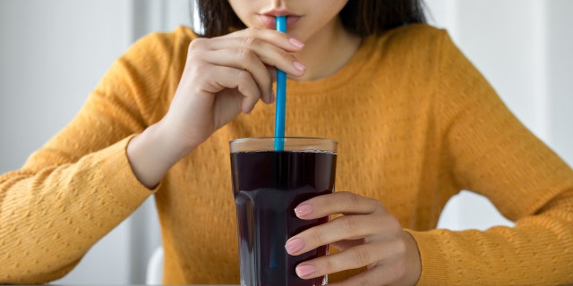 Person drinking soda