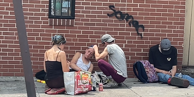 Heroin addicts inject on the streets of Philadelphia