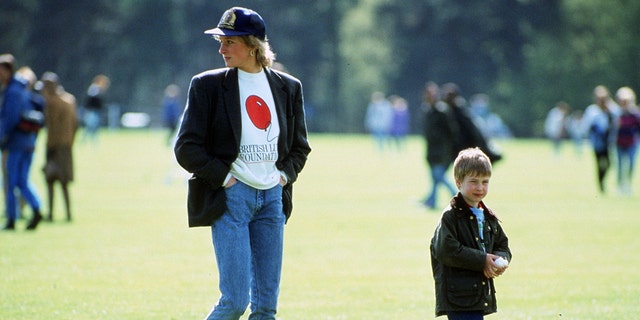 Princess Diana wearing a blazer, baseball cap and boots