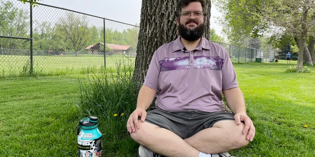 Psychedelic-assisted therapist sits by tree