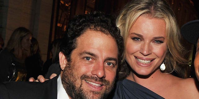 Rebecca Romijn smiling with Brett Ratner