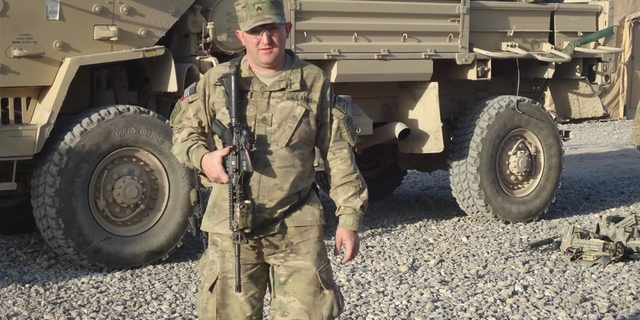 Monte Bernardo in the army in front of a truck