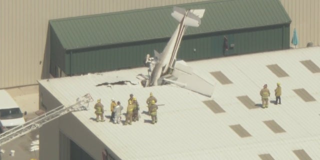 Long Beach Airport plane stuck in building