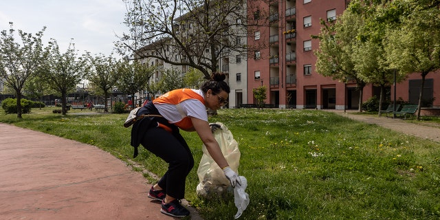 Volunteer cleaning up the street