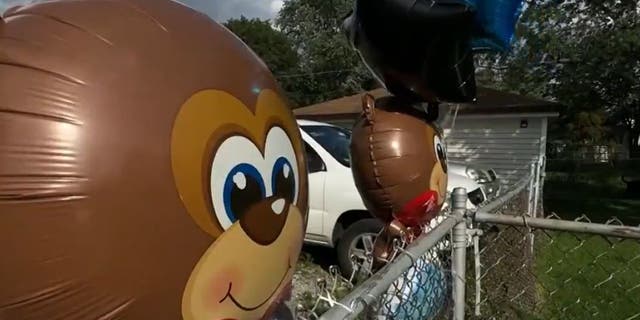 Balloons at birthday party where child was shot and killed