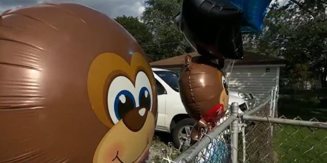 Balloons at birthday party where child was shot and killed