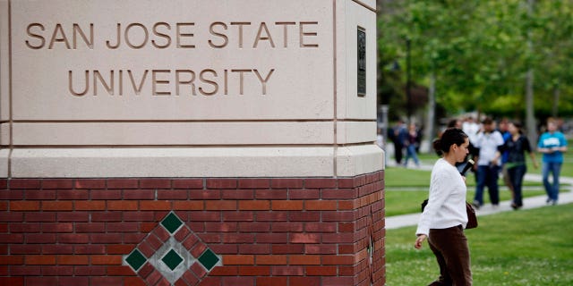 student walks on San Jose State University campus